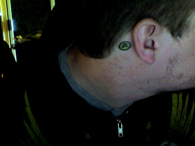  not know I have a tattoo of the XBOX 360's A Button behind my right ear.